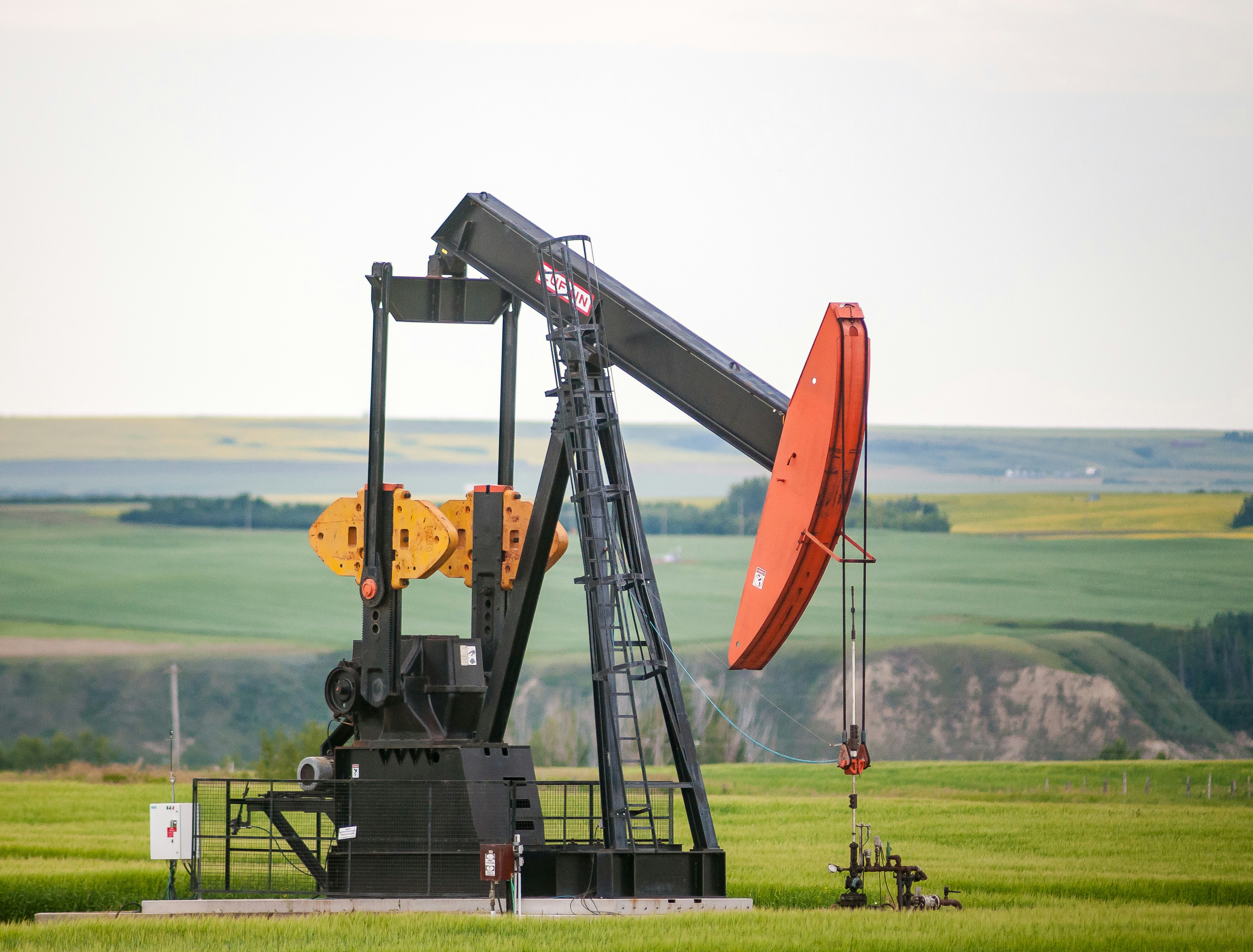 Pumpjack operating in open field — upstream oil and gas production