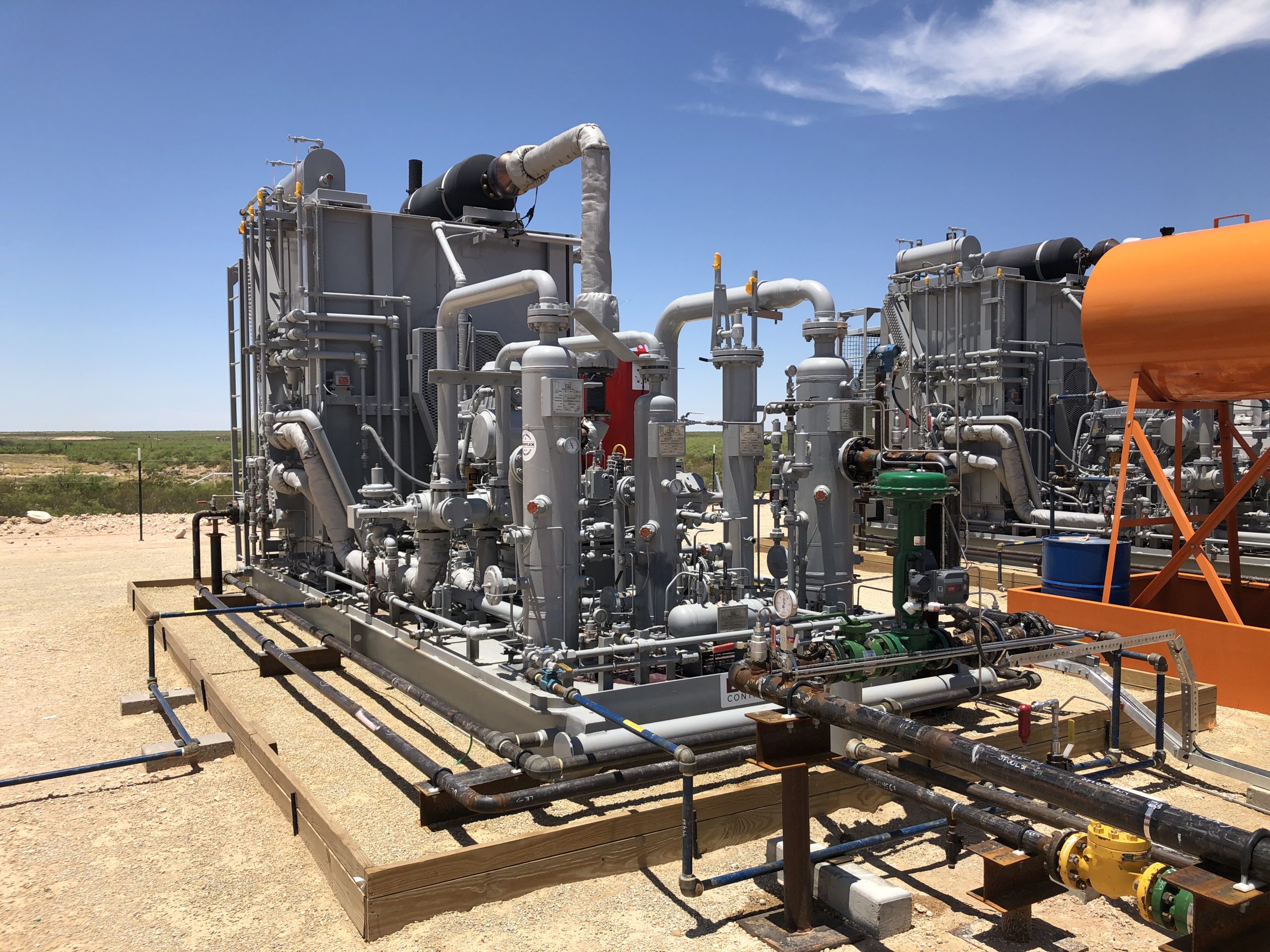 Upstream gas lift compressor and processing equipment at a well pad