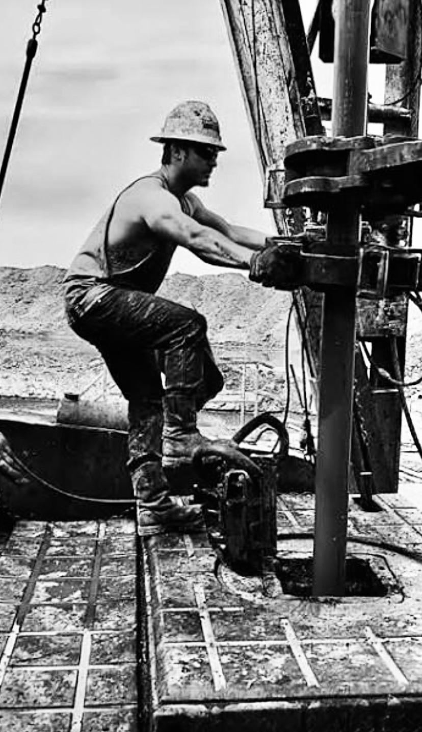 Multiple pumpjacks operating at sunset