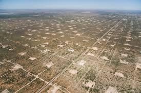 Aerial grid view of oil field operations