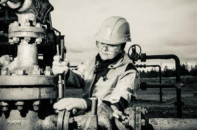 Field worker demonstrating safety protocols and equipment